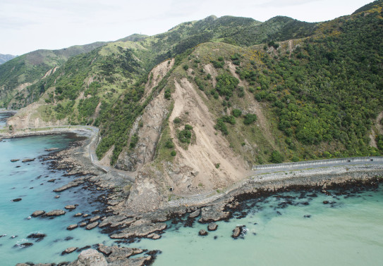 An aerial image that shows the damage from the Kaikōura earthquake around the hills - showing the slips. It shows the damaged road and seafloor.