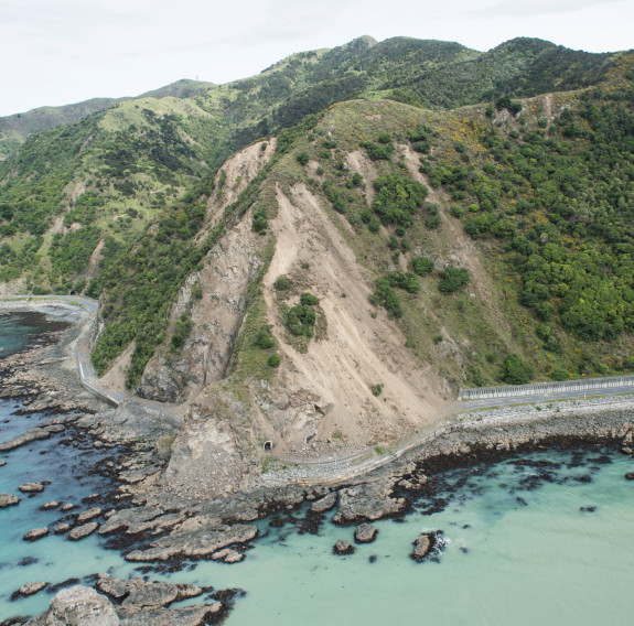 An aerial image that shows the damage from the Kaikōura earthquake around the hills - showing the slips. It shows the damaged road and seafloor.