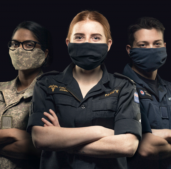 NZDF personnel with masks on and arms crossed.