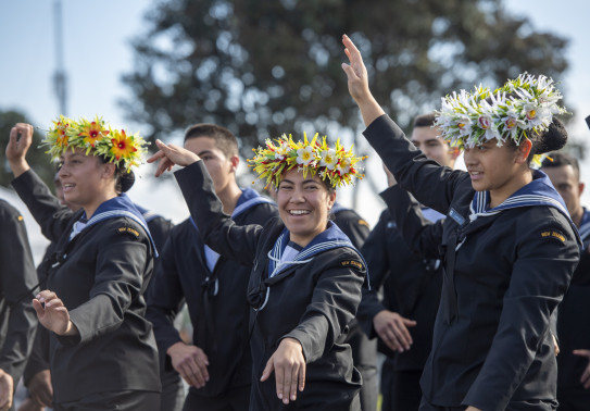 Royal New Zealand Navy sailors perform a Pacific Island dance at a Navy graduation ceremony 
