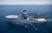 HMNZS Manawanui sails in the ocean on a nice day.