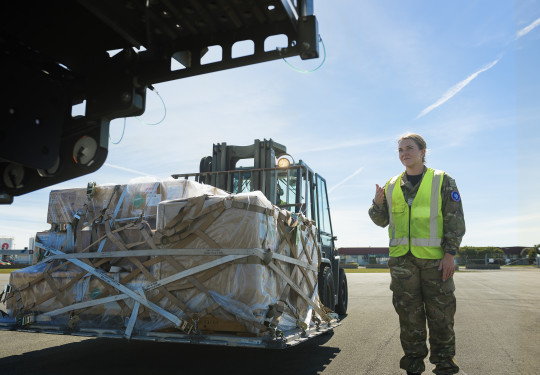 A/SGT Alice Smith prepares cargo on the tarmac of the Harewood Terminal in Christchurch.