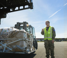 A/SGT Alice Smith prepares cargo on the tarmac of the Harewood Terminal in Christchurch.