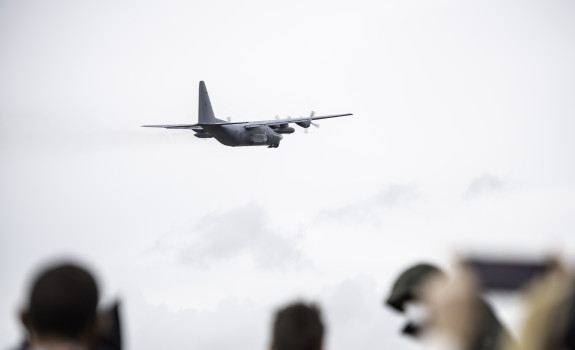 A Royal New Zealand Air Force Hercules aircraft leaves Base Auckland as people watch