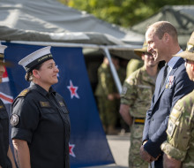 LYDS Anya Ruri talks to Prince William at Pirbright Camp.