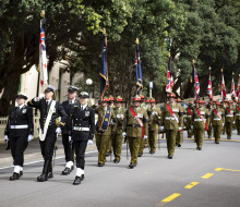 NZDF personnel parade Her Majesty The Queen’s flag for New Zealand for final time