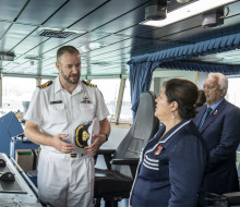 CDR Dave Barr discusses the capabilities of HMNZS Aotearoa with HEGG Cindy Kiro.