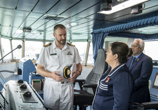 CDR Dave Barr discusses the capabilities of HMNZS Aotearoa with HEGG Cindy Kiro.