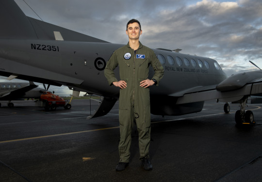 Flight Lieutenant Tyler Ngapo standing infront of the King Air aircraft