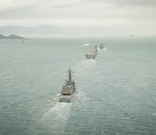 Three ships, photographed from a helicopter sail into Wellington harbour.