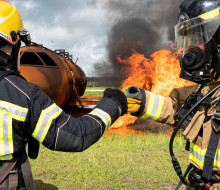 Royal New Zealand Air Force and U.S. Air Force firefighters fist bump prior to conducting a joint live-fire training exercise during Mobility Guardian 23 at Andersen Air Force Base, Guam. 