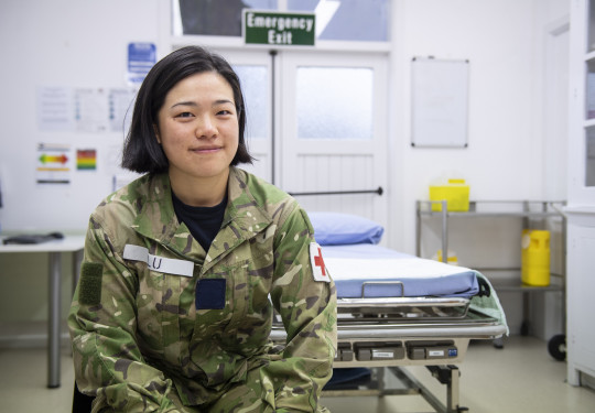 Aircraftman Victoria Lu sitting in a medical room. 