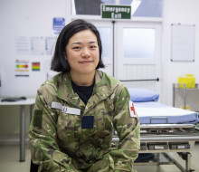 Aircraftman Victoria Lu sitting in a medical room. 