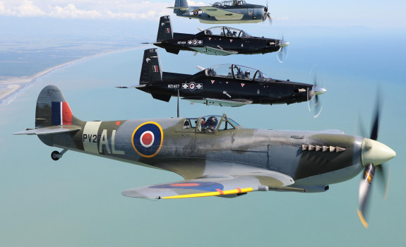 Past and present: Air Force Heritage Flight aircraft the Spitfire (bottom of photo) and Avenger (top) flying in formation with Texans from the Central Flying School at Ohakea