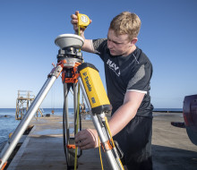 Able Hydrographic Systems Operator Joshua Phillips is a world away from mid-winter Milton as he carrying out surveying work in the tropical heat of Niue with the New Zealand Defence Force