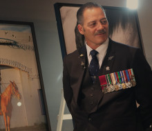 Former New Zealand Army Special Air Service soldier and Victoria Cross recipient, Willie Apiata, with auction items at his fundraiser for Ngāti Porou in Auckland