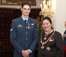 CPL Adam Brown with the Governor-General of New Zealand Her Excellency The Rt Hon Dame Cindy Kiro stand side-by-side looking at the camera