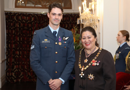 CPL Adam Brown with the Governor-General of New Zealand Her Excellency The Rt Hon Dame Cindy Kiro stand side-by-side looking at the camera