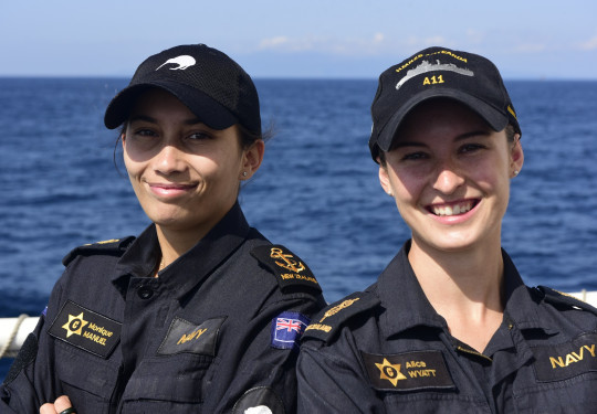 Leading Chef Monique Manuel and Able Chef Alice Wyatt both look at the camera in uniform, smiling. 