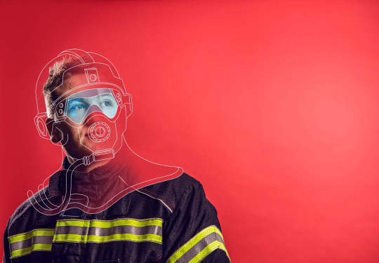 RNZAF Firefighter looking away from camera. The image is a mix of photo and graphic. Red background and illustrations drawn over his head