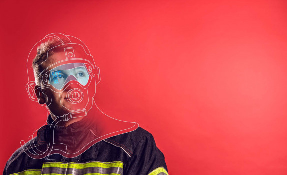 RNZAF Firefighter looking away from camera. The image is a mix of photo and graphic. Red background and illustrations drawn over his head