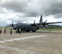 The Royal New Zealand Air Force C-130 Hercules arrives in Port Moresby.