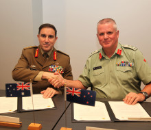New Zealand Chief of Army Major General John Boswell (right) and Australian Chief of Army Lieutenant General Simon Stuart signing Plan Anzac in Wellington, reinvigorating longstanding cooperation between the two armies.