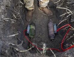 Explosive charges are placed on the Second World War ordnance for safe disposal