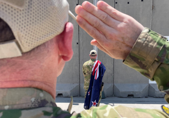 The New Zealand flag is lowered at the Combined Joint Task Force – Operation Inherent Resolve headquarters in Iraq, marking the end of the NZDF’s contribution to the D-ISIS Coalition’s military operation.