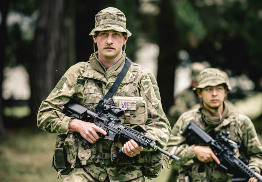 Private Gallant and a fellow recruit listen to a brief prior to leaving for the field phase of training