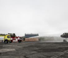 RNZAF and USAF firefighting vehicles conduct training on a fuselage