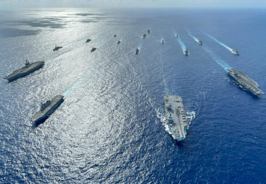 A fleet of Navy ships on the ocean