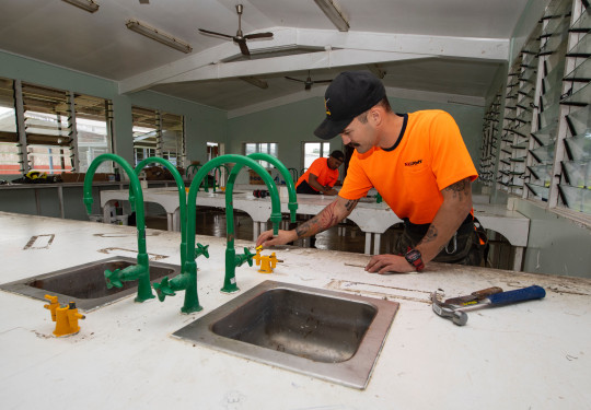  Sapper James Guild-Inder, foreground, and Sapper Gage Fowler start work on refurbishing work in the school’s science lab.