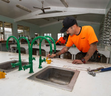 Sapper James Guild-Inder, foreground, and Sapper Gage Fowler start work on refurbishing work in the school’s science lab.
