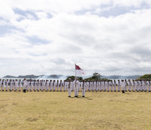 The Royal New Zealand Navy Royal Guard of Honour stands to attention as HMNZS Wellington conducts a 21-gun salute at the 2021 celebration.