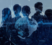 Graphic of five silhouettes of people that is a mix of light and dark blue. In the background, there is a city and over top of the people a globe and numbers. The image represents 'intelligence' 