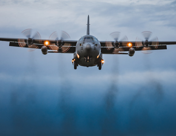 A Royal New Zealand Air Force Hercules aircraft lands in the UK ready to soon begin transporting donated military aid between centres in Europe. Credit: RAF