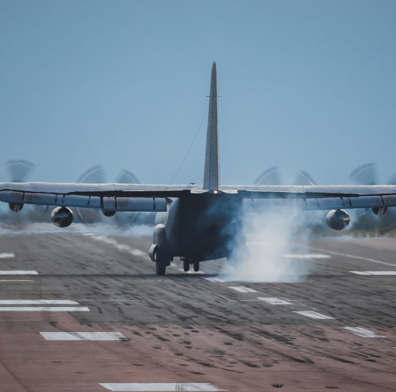 A Royal New Zealand Air Force Hercules aircraft lands in the UK ready to soon begin transporting donated military aid between centres in Europe. Credit: RAF