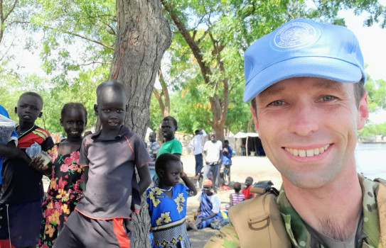 Major Dan Swale engages with the communities youth while on patrol in Akobo