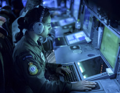 An Air Warfare Officer at work during a patrol on a P-3K2 Orion aircraft. 