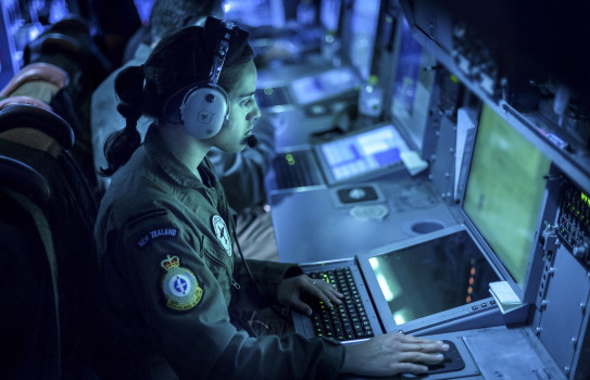An Air Warfare Officer at work during a patrol on a P-3K2 Orion aircraft.