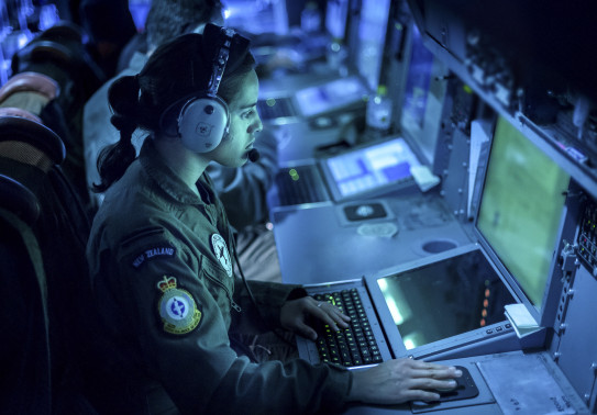 An Air Warfare Officer at work during a patrol on a P-3K2 Orion aircraft. 