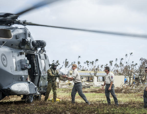 A RNZAF NH90 Helicopter lands in Nasau, Koro Island to deliver personnel, aid, and equipment.