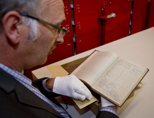 John Crawford with the historic notebooks of the Deputy Assistant Adjutant General from World War One.