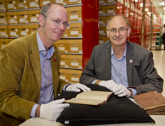 Matthew Buck and John Crawford with the historic notebooks of the Deputy Assistant Adjutant General from World War One.