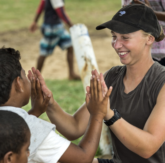 A member of the Amphibious Beach Team plays a game of "ABC" with a local child at Lomaloma on Vanua Balavu Island, during a lull in New Zealand Defence Force amphibious operations.