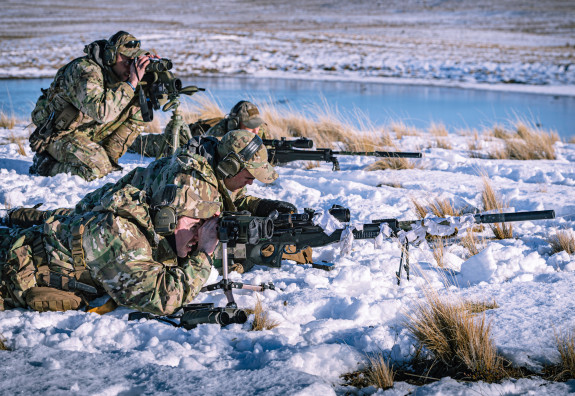 Shooters and spotters in the snow at the Tekapo Military Training Area during an exercise.
