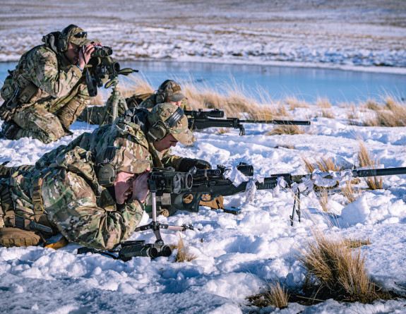 Shooters and spotters in the snow at the Tekapo Military Training Area during an exercise.