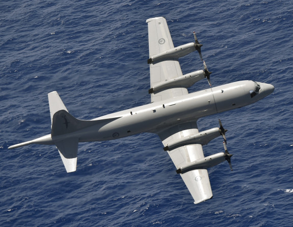 A P-3K2 Orion aircraft flying over the ocean
