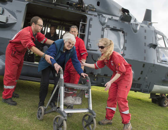 Members of the New Zealand Red Cross assist evacuated people from an Air Force NH90 Helicopter at Woodend School, Christchurch an earthquake on 14 Nov 16.